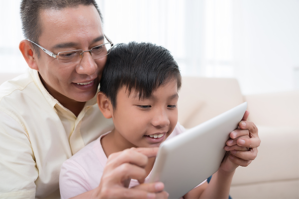 Parent-and-child-holding-ipad
